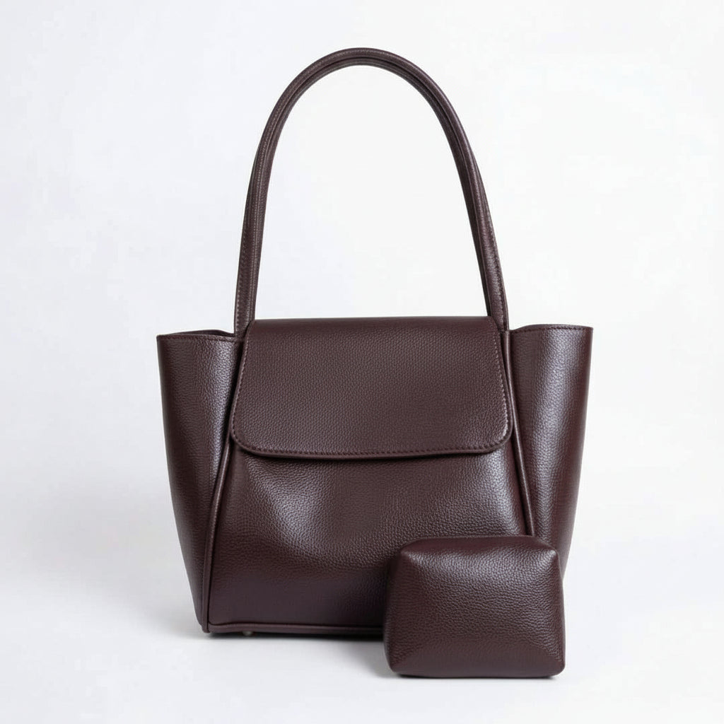 Brown handbag with matching pouch on a white background